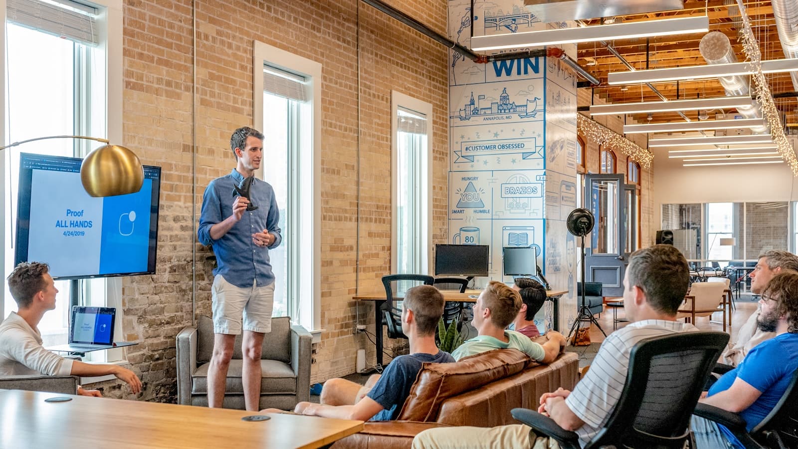 A small business team reviewing their workflow together in their office